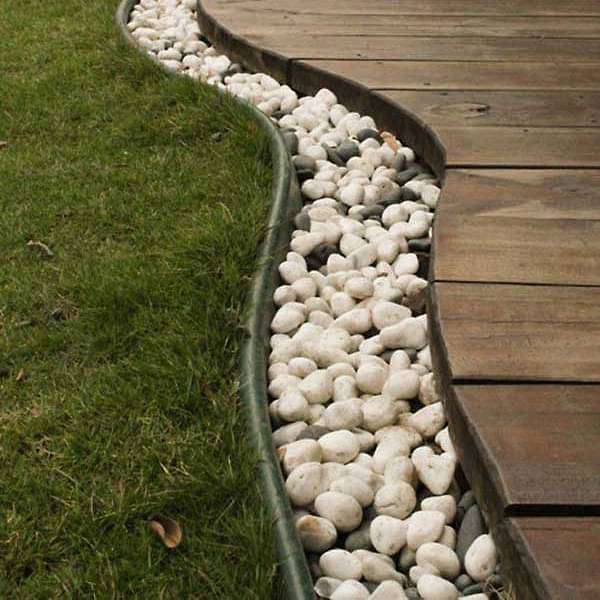 diy garden border with white marble pebbles 