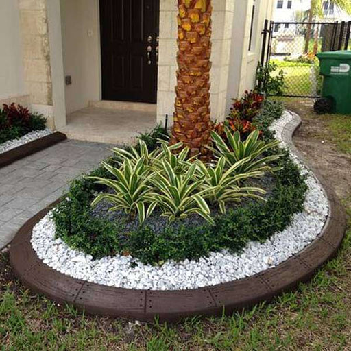 pebbles border around plants 