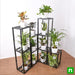 create greenery with houseplants on metal stand in indirect bright light 